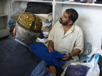 Tailor discussing making my shalwaar kameez