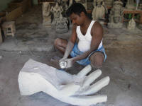 Sculptor using modern tools