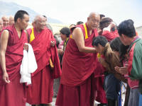 Being blessed by the Rinpoche, head of the monastary