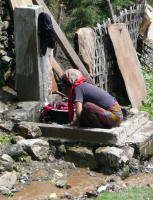 Washing clothes in a mountain stream on the road (Jay)