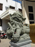 One of a pair of lions guard the Chini Bagh. Pairs of lions guard many buildings in China
