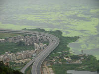 The lake with algae and housing developments