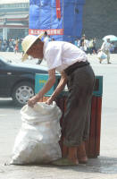 Same old man collecting empty plastic bottles. One of the poor. (John)
